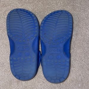 Worn blue crocs